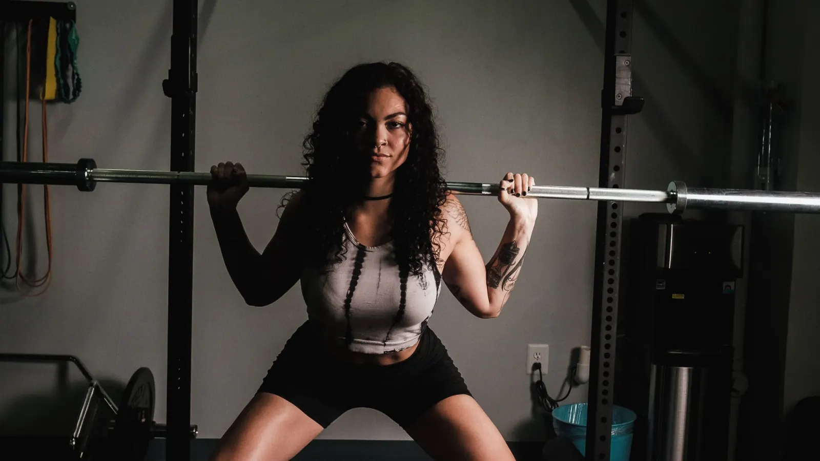 Athlete training with a barbell in a gym